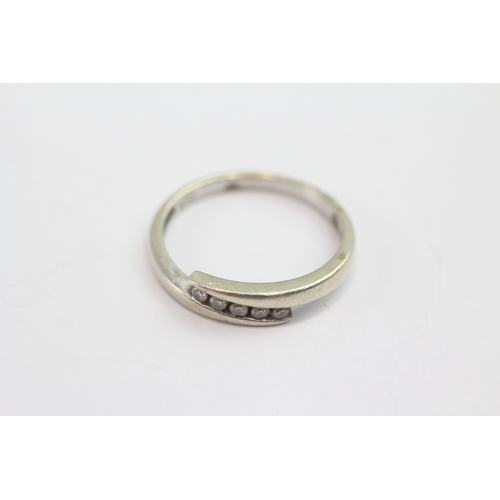 37 - 9ct white gold diamond set bypass ring (1.8g) Size N 1/2