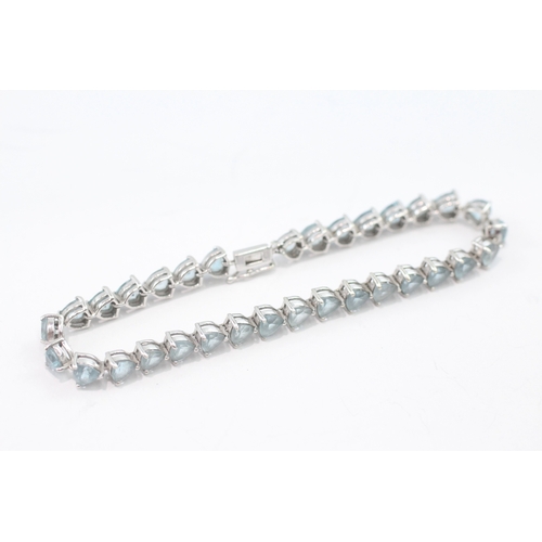 5 - 9ct white gold blue topaz tennis bracelet (13.9g)