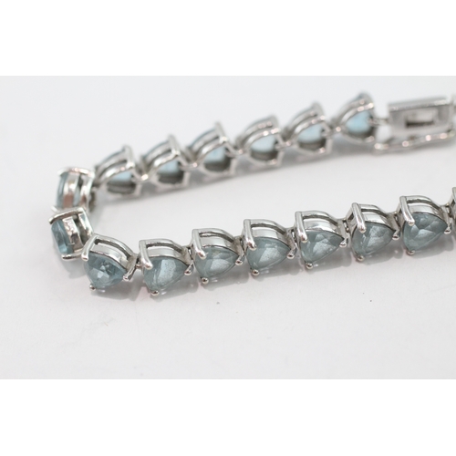 5 - 9ct white gold blue topaz tennis bracelet (13.9g)