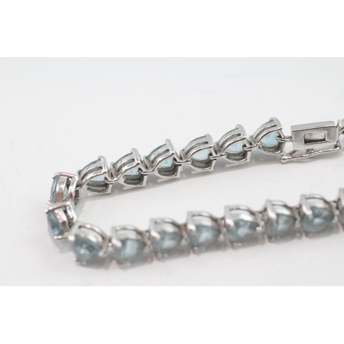 5 - 9ct white gold blue topaz tennis bracelet (13.9g)