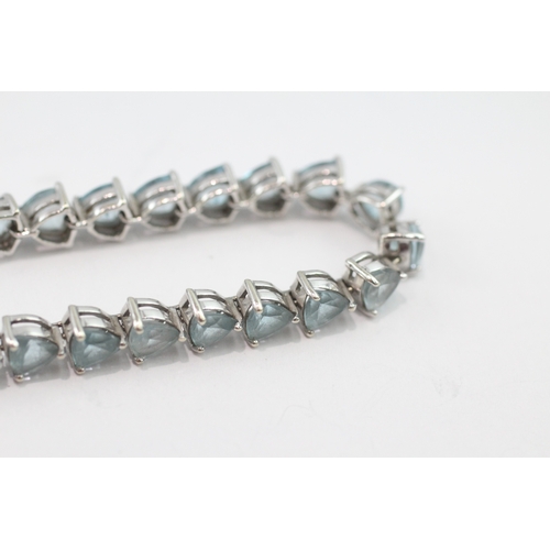 5 - 9ct white gold blue topaz tennis bracelet (13.9g)