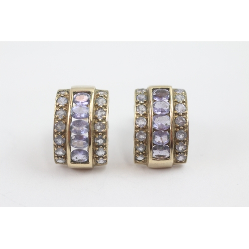 10 - 9ct gold tanzanite c-hoop earrings (4.7g)