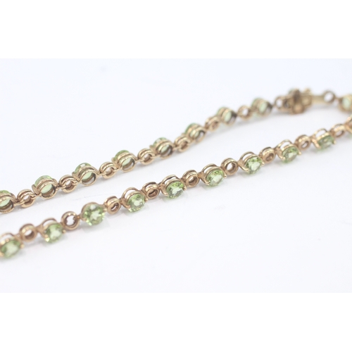 27 - 9ct gold peridot tennis bracelet (6.3g)