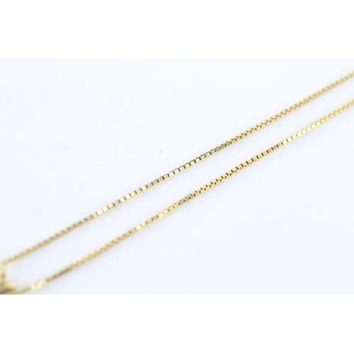 43 - 14ct gold ruby single pendant on chain (3g)