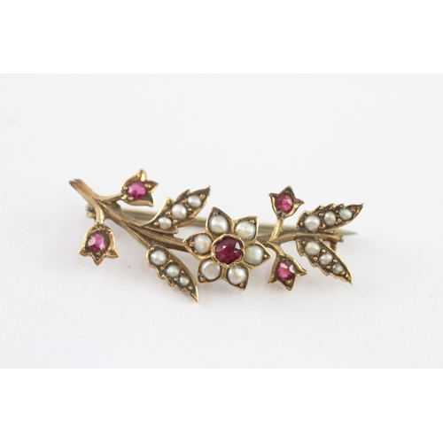 6 - 9ct gold ruby and seed pearl floral brooch (3.2g)