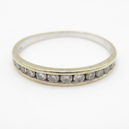 114 - 9ct gold diamond row ring (1.1g) Size L