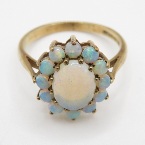 66 - 9ct gold opal halo ring (2.9g) Size O