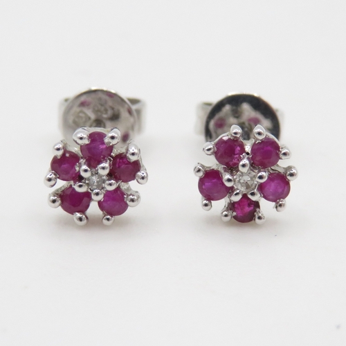 68 - 9ct white gold ruby and diamond stud earrings (1.1g)