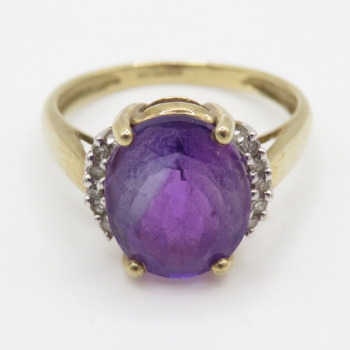 72 - 9ct gold amethyst and diamond framed ring (2.7g) Size N