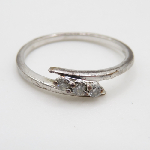 75 - 9ct white gold diamond three stone ring (1.4g) Size M