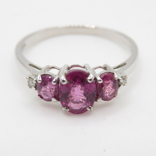 89 - 9ct white gold diamond and amethyst trilogy dress ring (1.8g) Size N