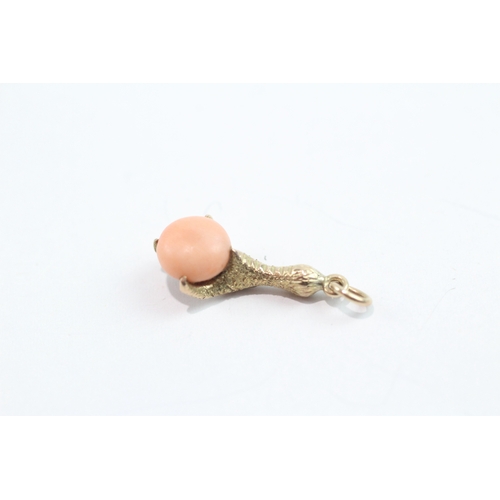 103 - 9ct gold coral claw charm (1.8g)