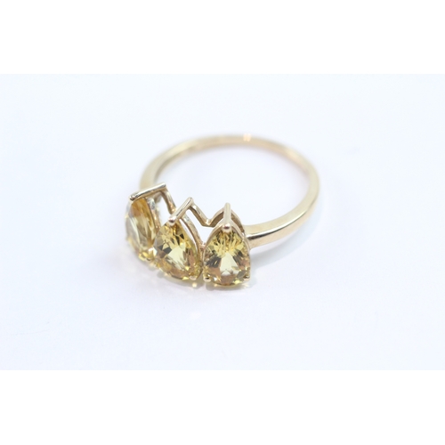 106 - 9ct gold pear cut citrine trilogy ring (2.2g) Size O