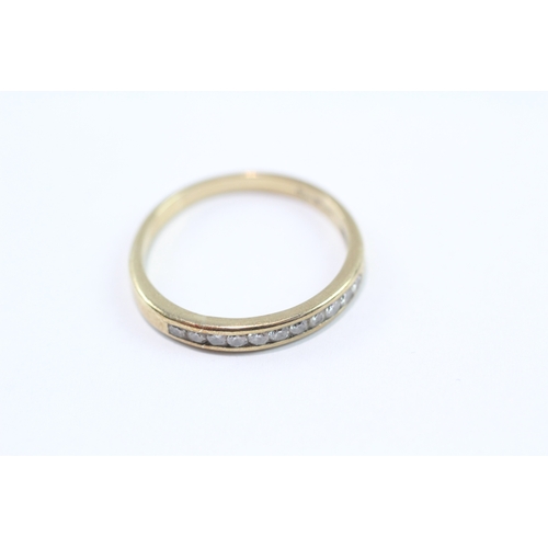 111 - 9ct gold diamond channel ring (1.7g) Size O