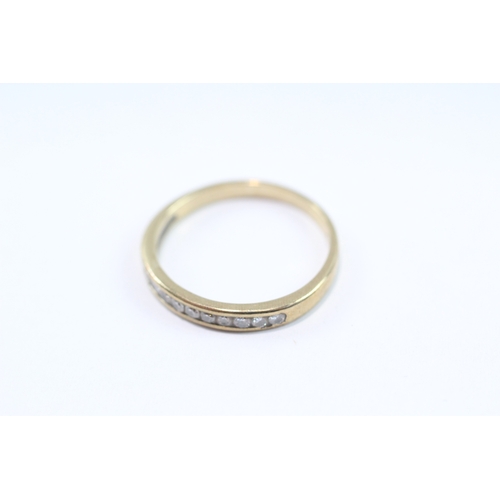 111 - 9ct gold diamond channel ring (1.7g) Size O