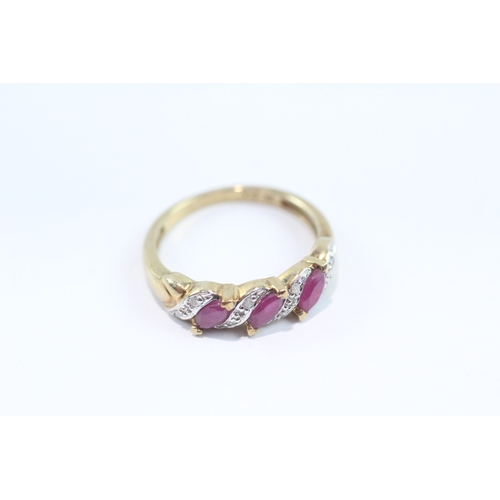 112 - 9ct gold diamond and ruby row ring (2.4g) Size O