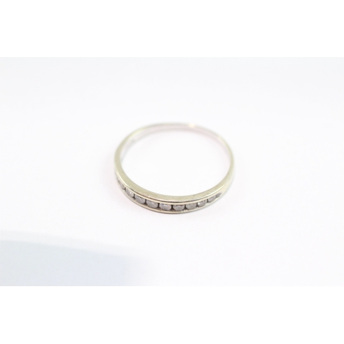 114 - 9ct gold diamond row ring (1.1g) Size L