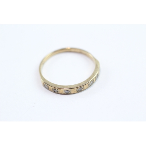 119 - 9ct gold diamond row ring (1.6g) Size O