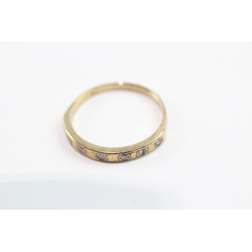 119 - 9ct gold diamond row ring (1.6g) Size O