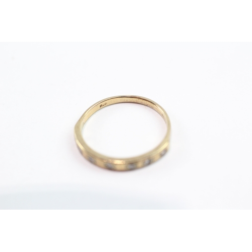 119 - 9ct gold diamond row ring (1.6g) Size O