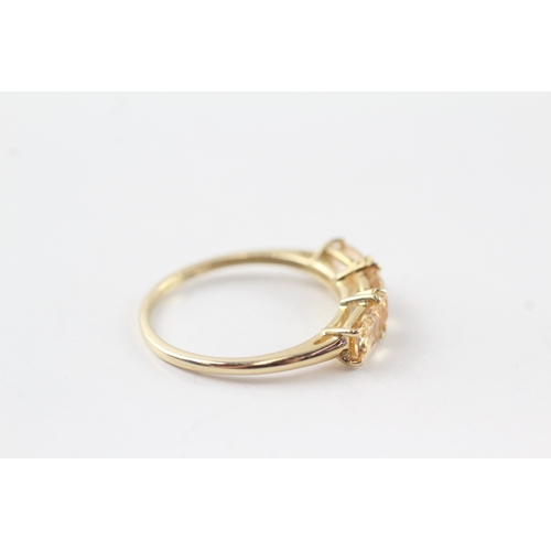 61 - 9ct gold citrine row ring (1.9g) Size P 1/2