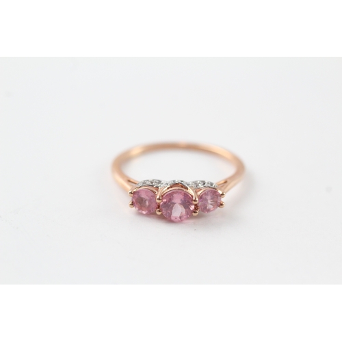 62 - 9ct gold diamond and pink sapphire trilogy ring (2.1g) Size Q