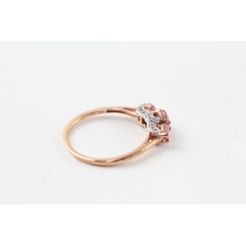 62 - 9ct gold diamond and pink sapphire trilogy ring (2.1g) Size Q