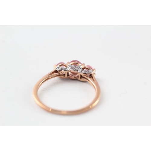 62 - 9ct gold diamond and pink sapphire trilogy ring (2.1g) Size Q