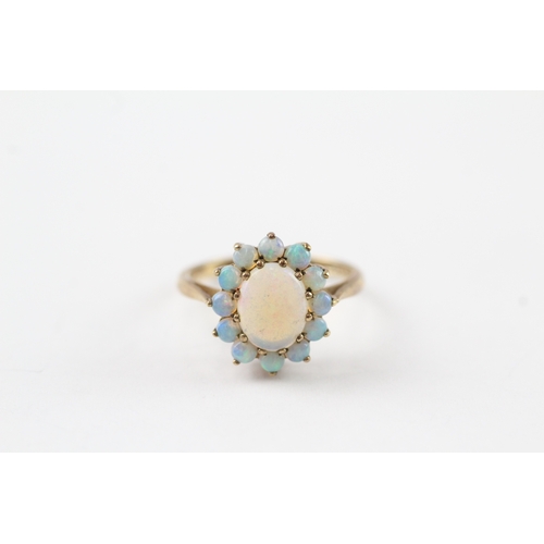 66 - 9ct gold opal halo ring (2.9g) Size O