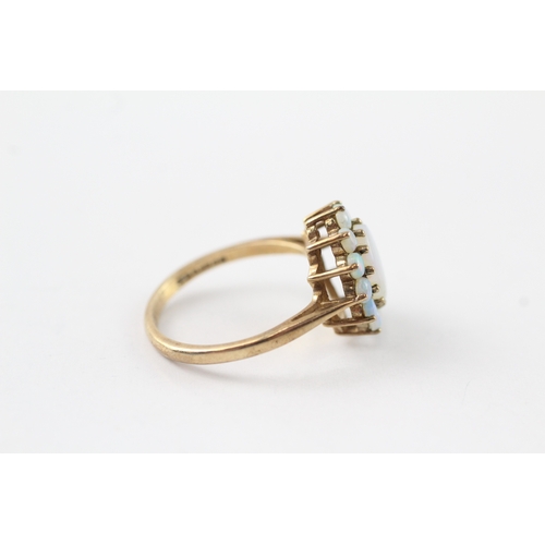 66 - 9ct gold opal halo ring (2.9g) Size O