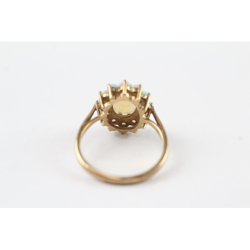 66 - 9ct gold opal halo ring (2.9g) Size O