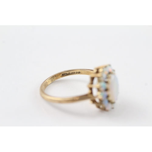 66 - 9ct gold opal halo ring (2.9g) Size O