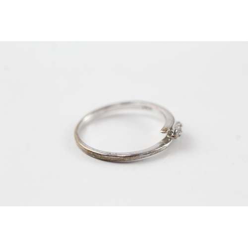 75 - 9ct white gold diamond three stone ring (1.4g) Size M
