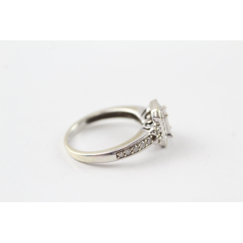 77 - 9ct white gold diamond cluster ring (3.3g) Size M