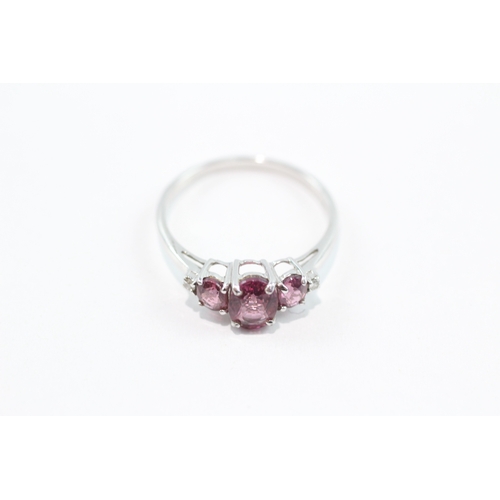 89 - 9ct white gold diamond and amethyst trilogy dress ring (1.8g) Size N