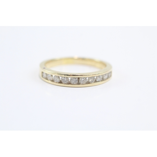 10 - 14ct gold diamond channel ring (3.4g) Size Q