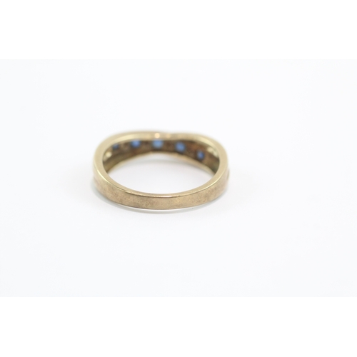 27 - 9ct gold sapphire diamond half eternity crossover ring (3.1g) Size O