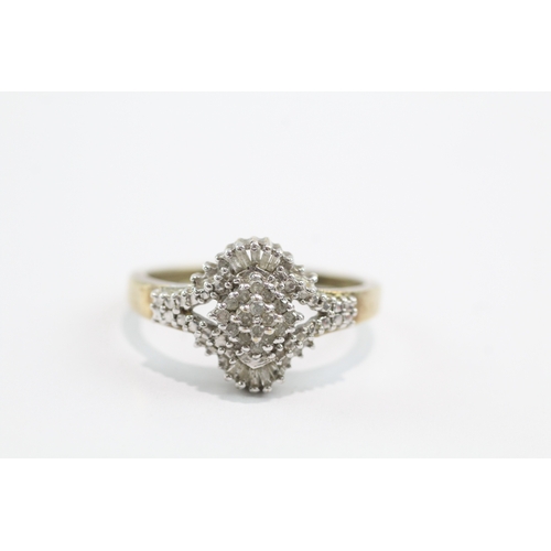 32 - 9ct gold baguette and round cut diamond ring (3.4g) Size V