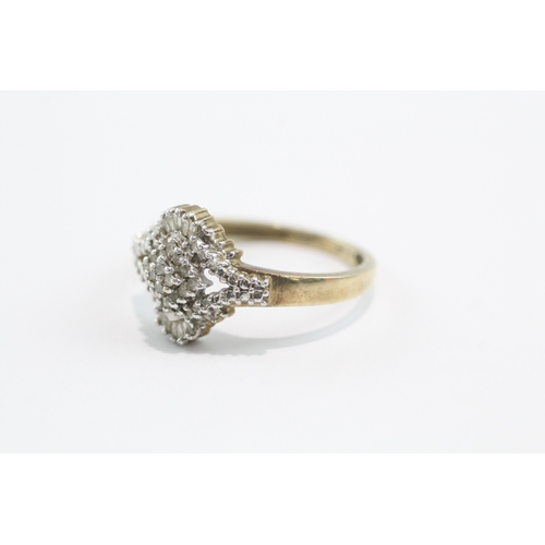 32 - 9ct gold baguette and round cut diamond ring (3.4g) Size V