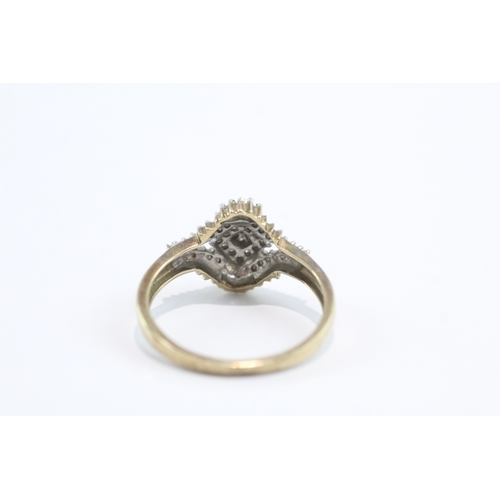 32 - 9ct gold baguette and round cut diamond ring (3.4g) Size V