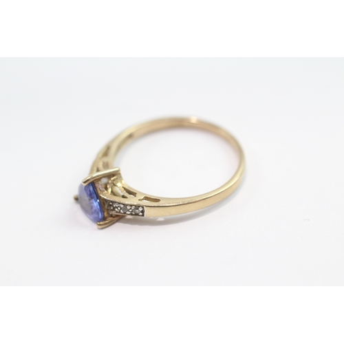 42 - 9ct gold tanzanite and white gemstone ring (1.8g) Size N