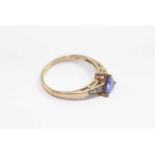 42 - 9ct gold tanzanite and white gemstone ring (1.8g) Size N