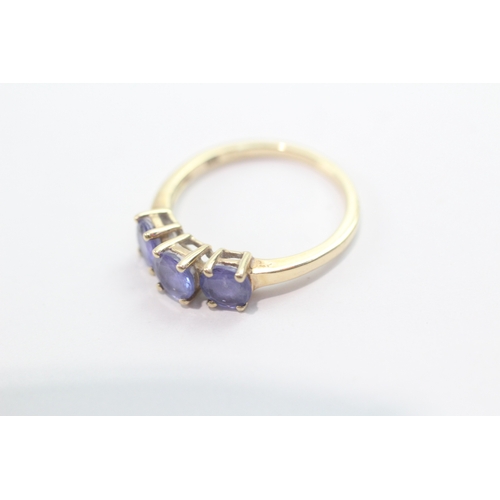 46 - 9ct gold tanzanite three-stone ring (1.9g) Size L 1/2