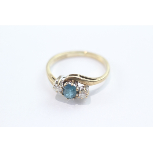 48 - 9ct gold blue topaz diamond trilogy crossover ring (2g) Size L