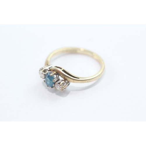 48 - 9ct gold blue topaz diamond trilogy crossover ring (2g) Size L