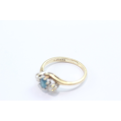 48 - 9ct gold blue topaz diamond trilogy crossover ring (2g) Size L