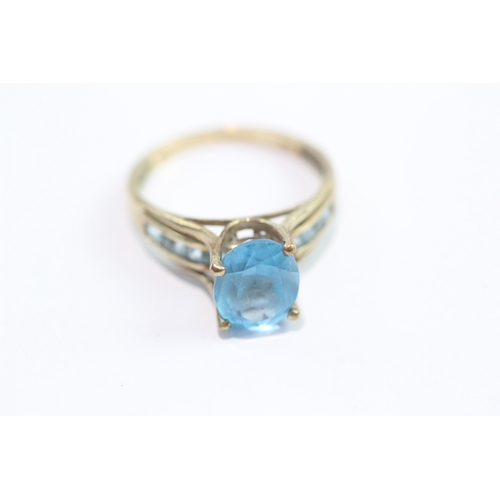 53 - 9ct gold blue topaz dress ring (3.2g) Size R