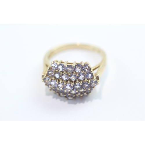 59 - 9ct gold tanzanite cluster ring (4.7g) Size Q
