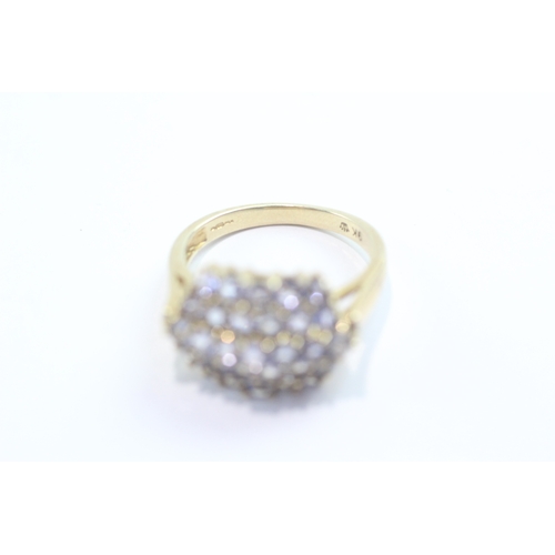 59 - 9ct gold tanzanite cluster ring (4.7g) Size Q