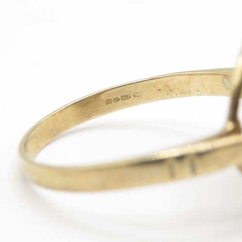 33 - 9ct gold emerald and diamond halo ring (2.7g) Size N